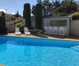 Holiday villa near Narbonne Plage fenced private swimming pool and view of a lake